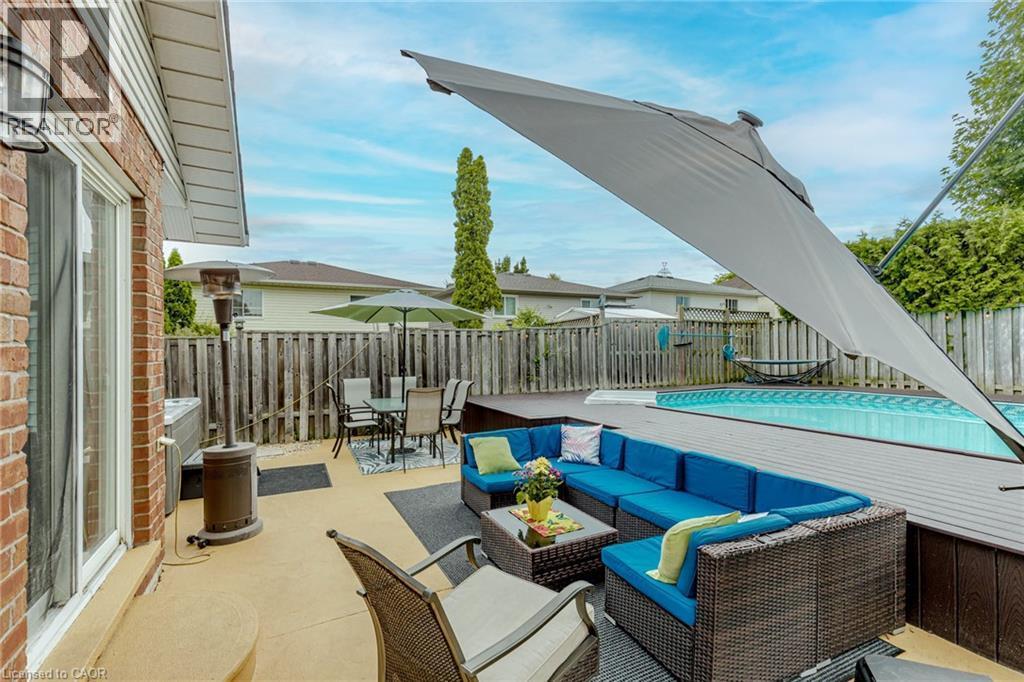 Fenced backyard with a patio area and an outdoor living / dining area - 32 Vineberg Drive, Hamilton, ON - Outdoor With Deck Patio Veranda With Exterior