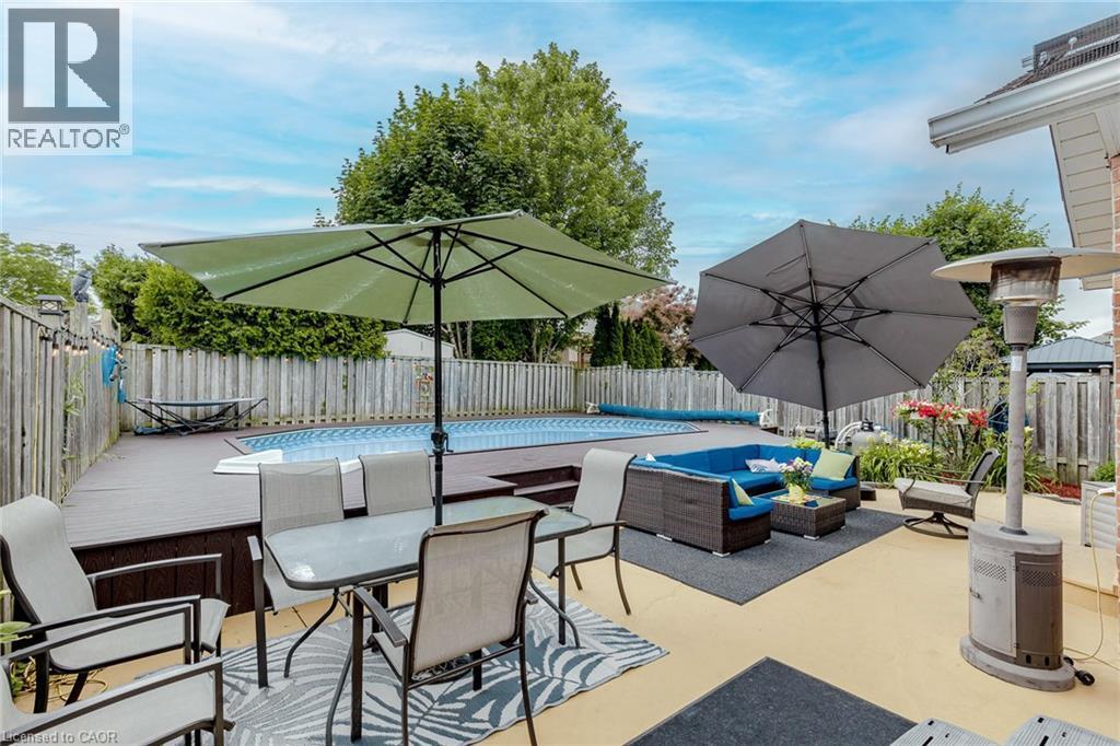 Fenced backyard featuring a patio area and an outdoor living / dining area - 32 Vineberg Drive, Hamilton, ON - Outdoor With Deck Patio Veranda