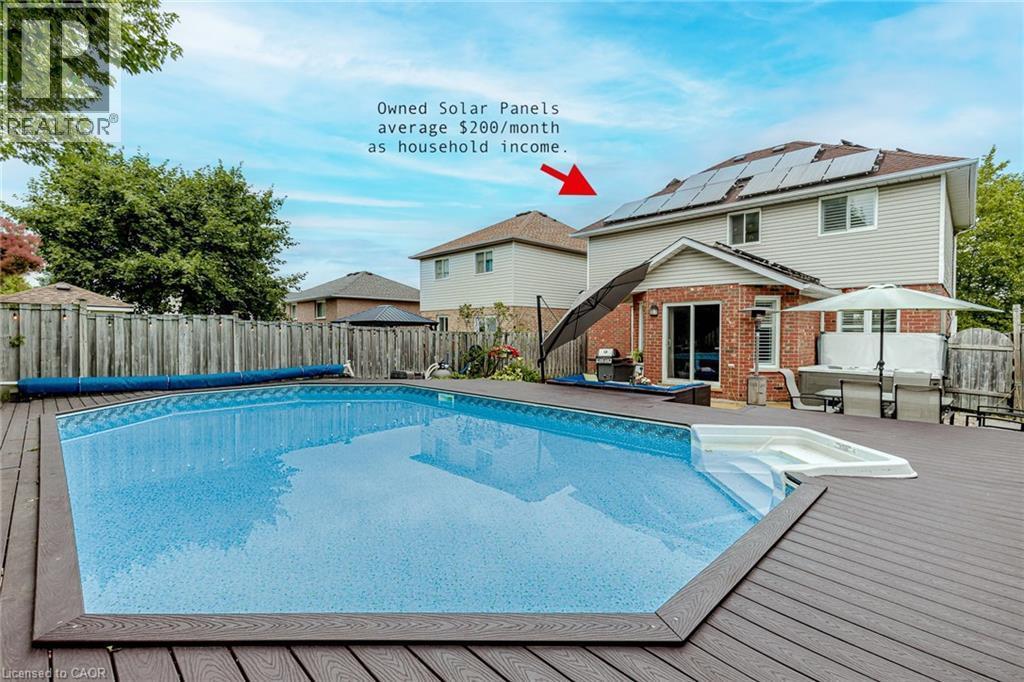 View of swimming pool featuring a wooden deck, a fenced backyard, grilling area, and patio surround - 32 Vineberg Drive, Hamilton, ON - Outdoor With In Ground Pool With Deck Patio Veranda With Backyard