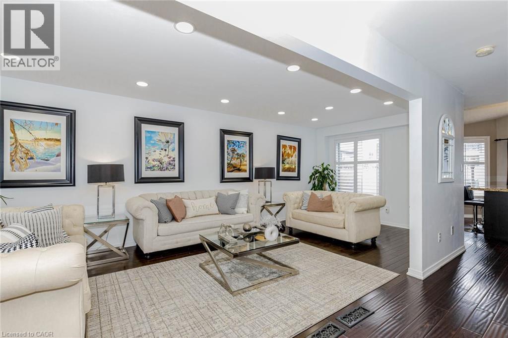 Living area featuring recessed lighting and dark wood-style flooring - 32 Vineberg Drive, Hamilton, ON - Indoor Photo Showing Living Room
