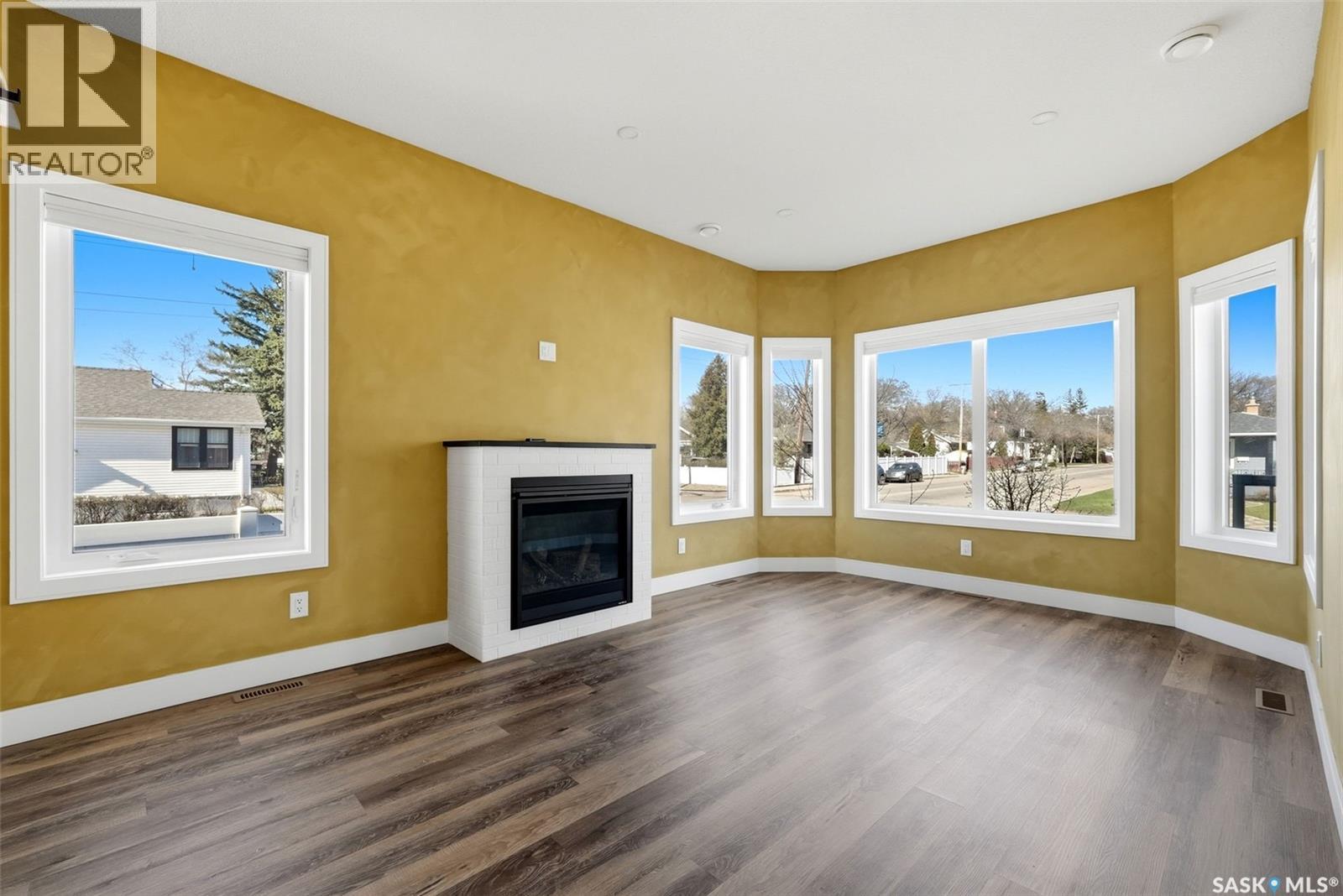 2100 Queen Street, Regina, SK - Indoor Photo Showing Living Room With Fireplace