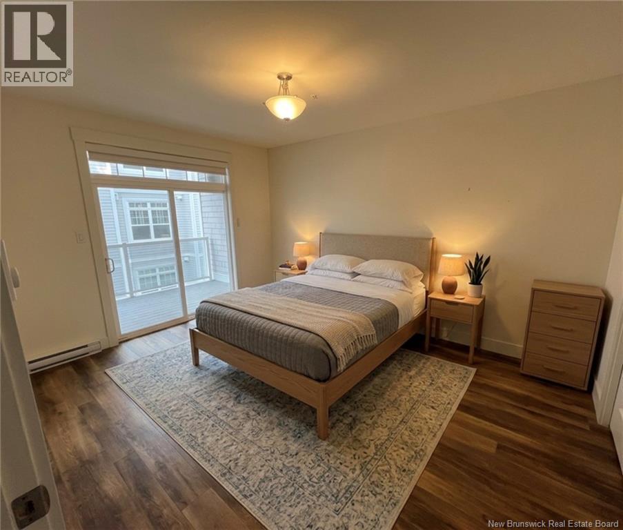 Master with Patio Access - 54 Hampton Road Unit# 206, Rothesay, NB - Indoor Photo Showing Bedroom