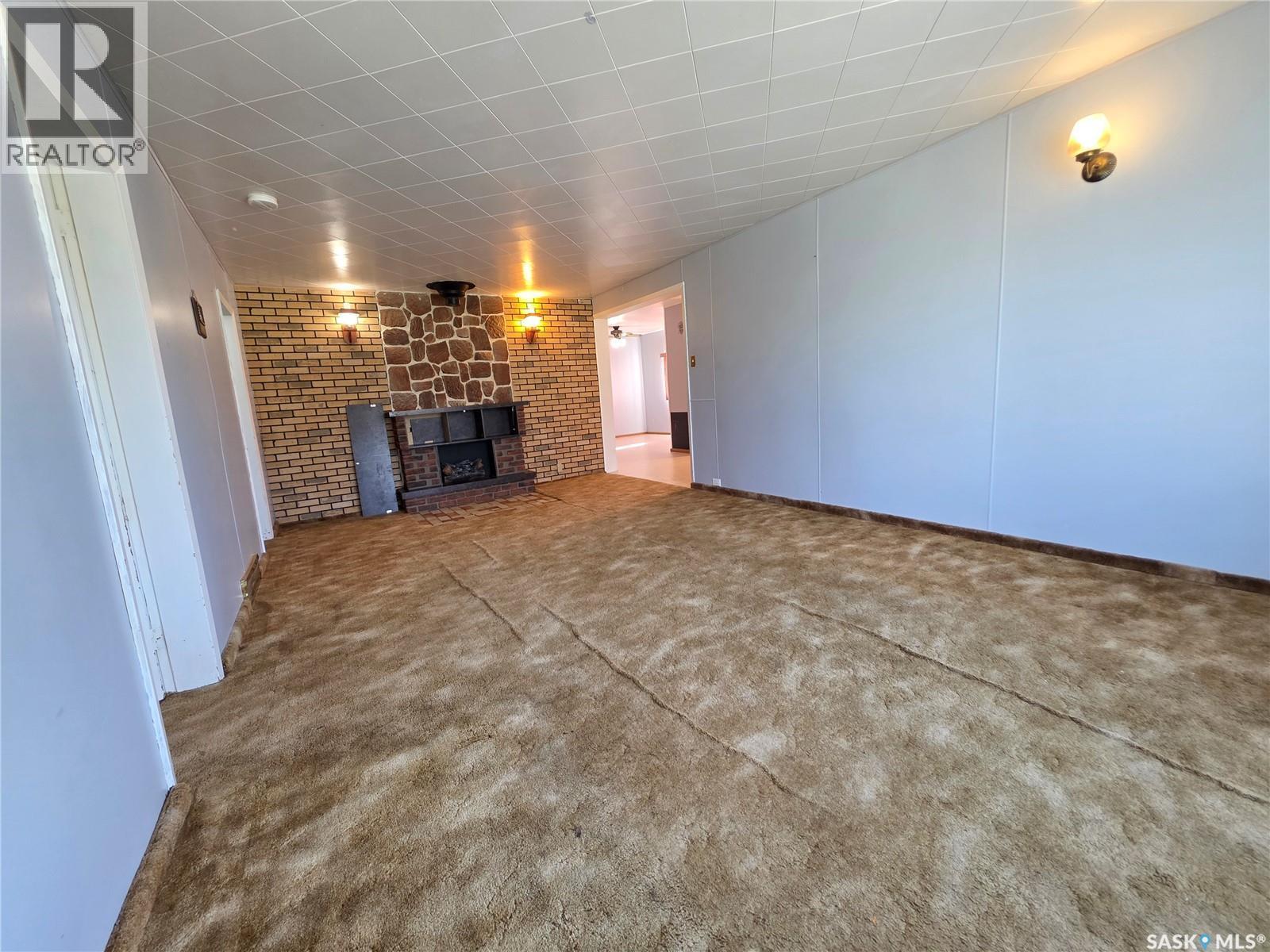 111 Warwick Street, Neville, SK - Indoor With Fireplace