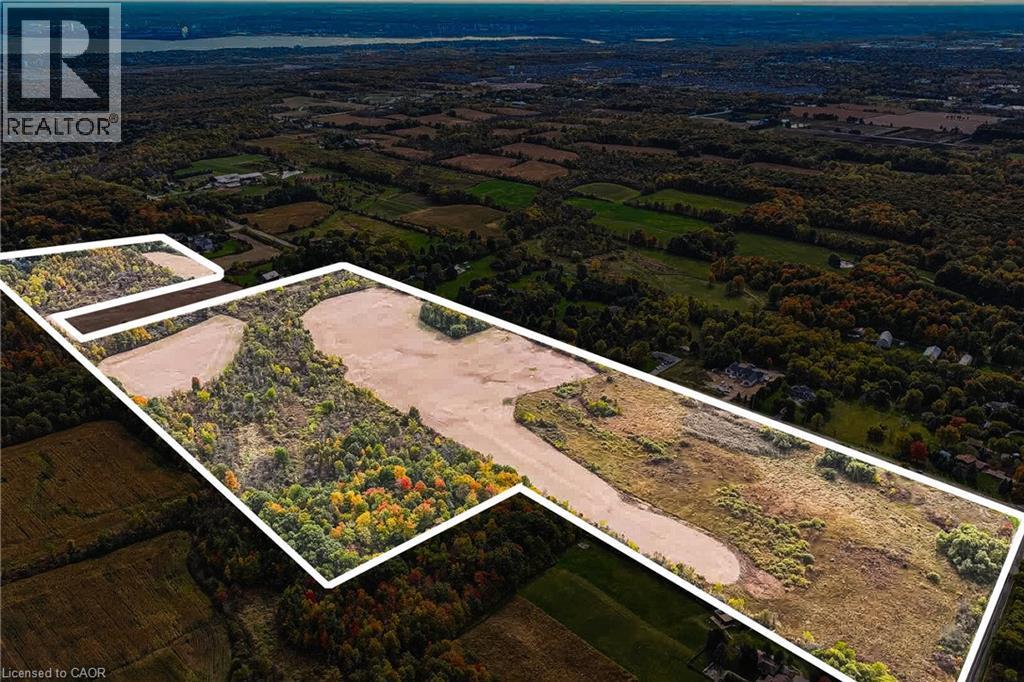 Expansive land parcel featuring a mix of open fields and mature woodland - 3415 Cedar Springs Road, Burlington, ON