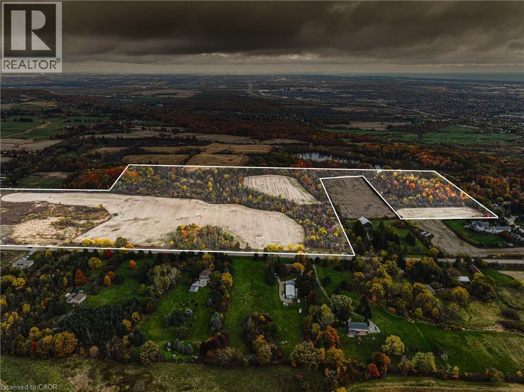 Expansive aerial showcasing a significant land parcel with defined boundaries - 3415 Cedar Springs Road, Burlington, ON