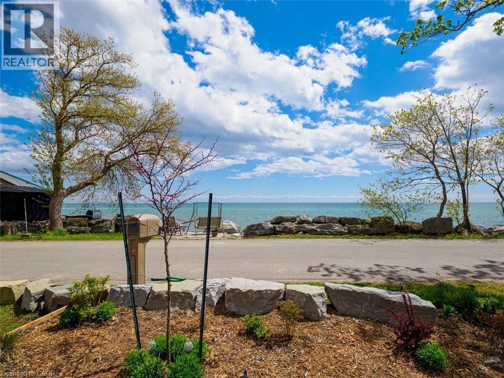 Waterfront property. Deeded property on each side of Lakeshore Road. Survey available. - 1395 Lakeshore Road, Haldimand County, ON - Outdoor With Body Of Water With View