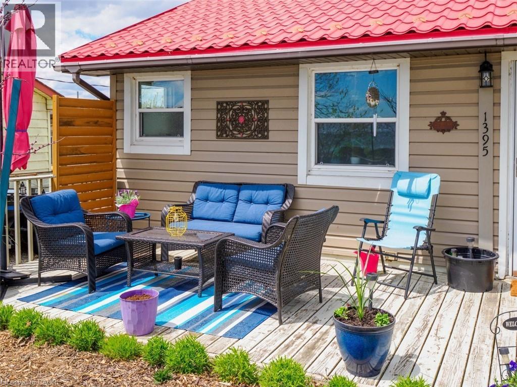 Front deck to enjoy sunrise and sunset overlooking the lake - 1395 Lakeshore Road, Haldimand County, ON - Outdoor With Body Of Water With View