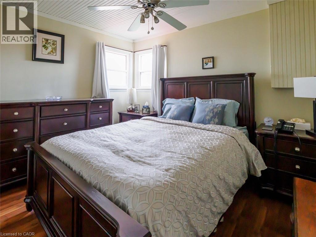 Primary Bedroom, queen size bed for reference and lots of room for extra dressers plus a wall of floor to ceiling custom closets. - 1395 Lakeshore Road, Haldimand County, ON - Indoor Photo Showing Bedroom