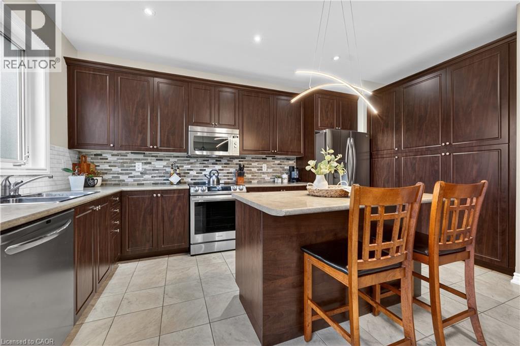 136 Whitwell Way, Binbrook, ON - Indoor Photo Showing Kitchen With Double Sink With Upgraded Kitchen