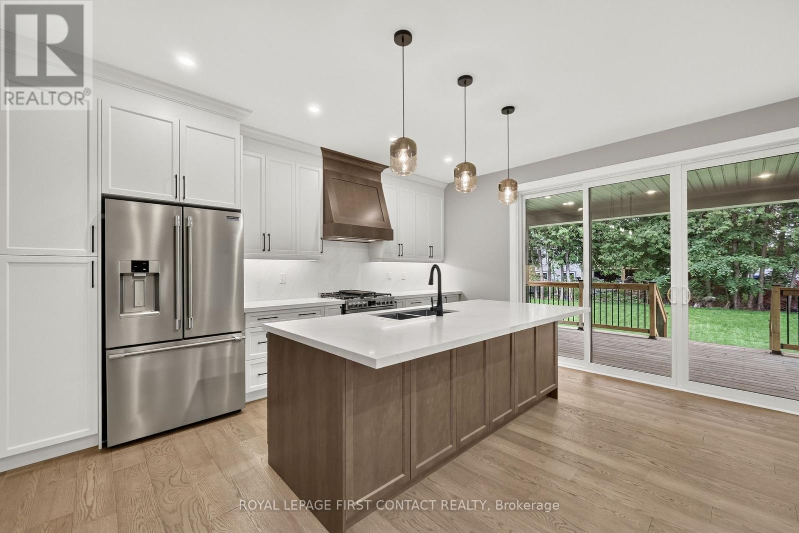 Kitchen and Covered Deck - Upper - 933 7Th Line, Innisfil, ON - Indoor Photo Showing Kitchen With Stainless Steel Kitchen With Double Sink With Upgraded Kitchen