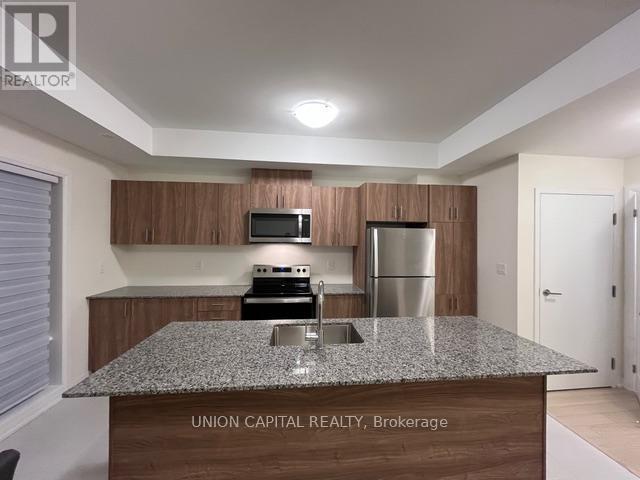 20 - 10 Liben Way, Toronto, ON - Indoor Photo Showing Kitchen With Double Sink