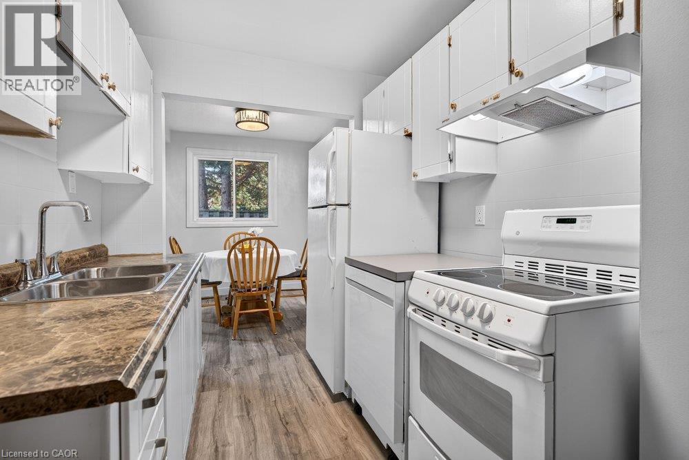 100 Quigley Road Unit# 85, Hamilton, ON - Indoor Photo Showing Kitchen With Double Sink