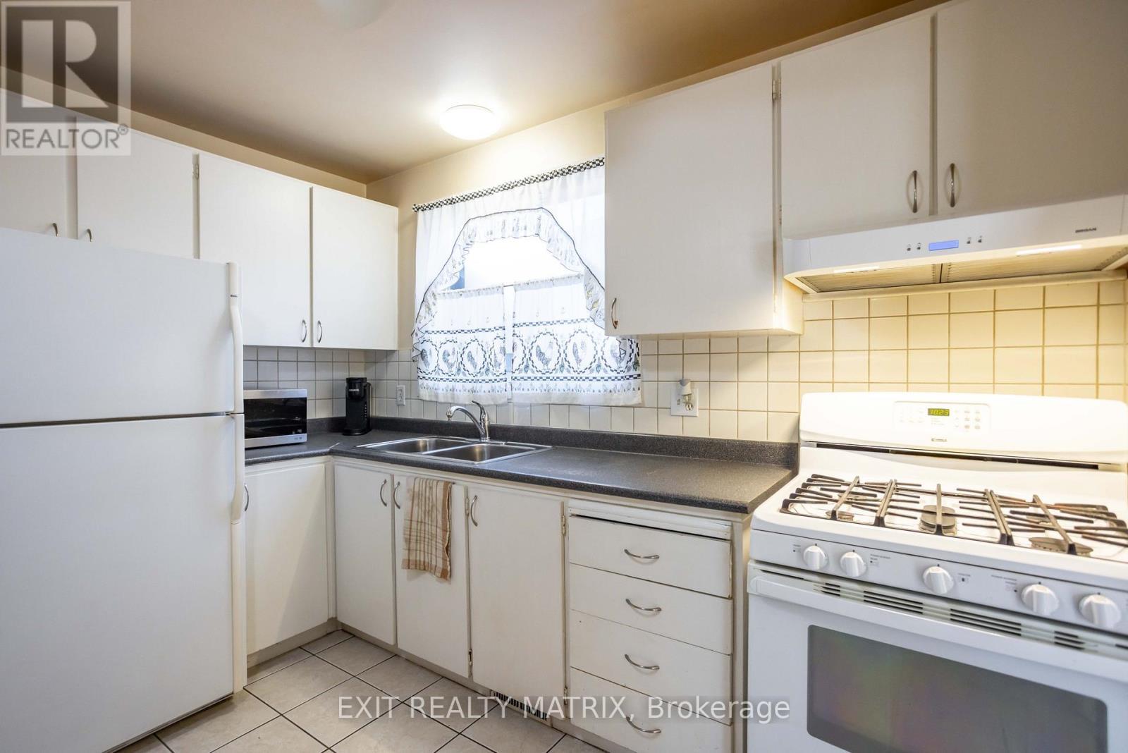 2064 St Laurent Boulevard, Ottawa, ON - Indoor Photo Showing Kitchen With Double Sink