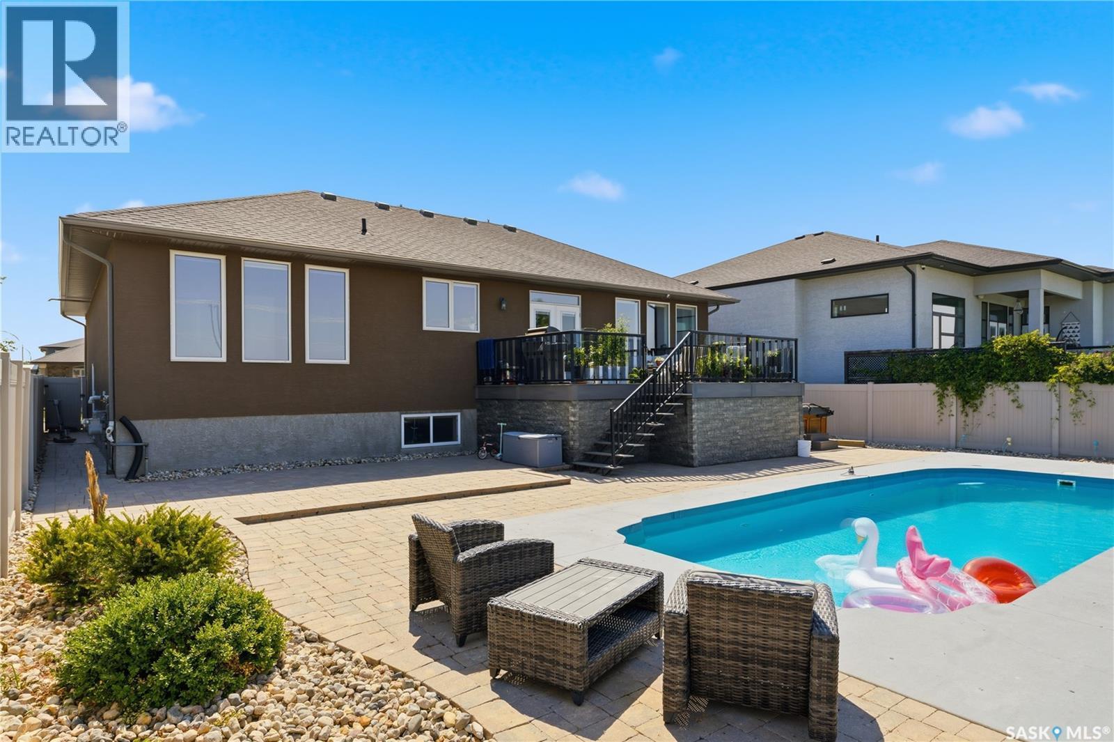 6024 Little Pine Loop, Regina, SK - Outdoor With In Ground Pool With Deck Patio Veranda