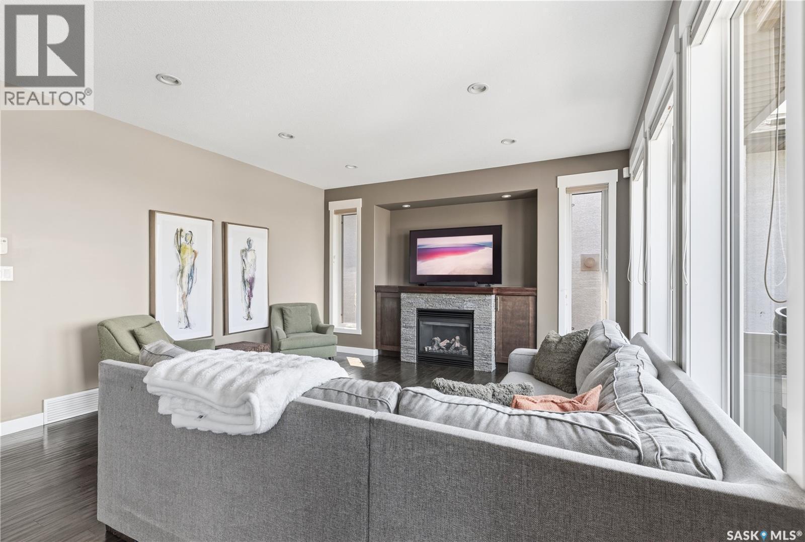 6024 Little Pine Loop, Regina, SK - Indoor Photo Showing Living Room With Fireplace