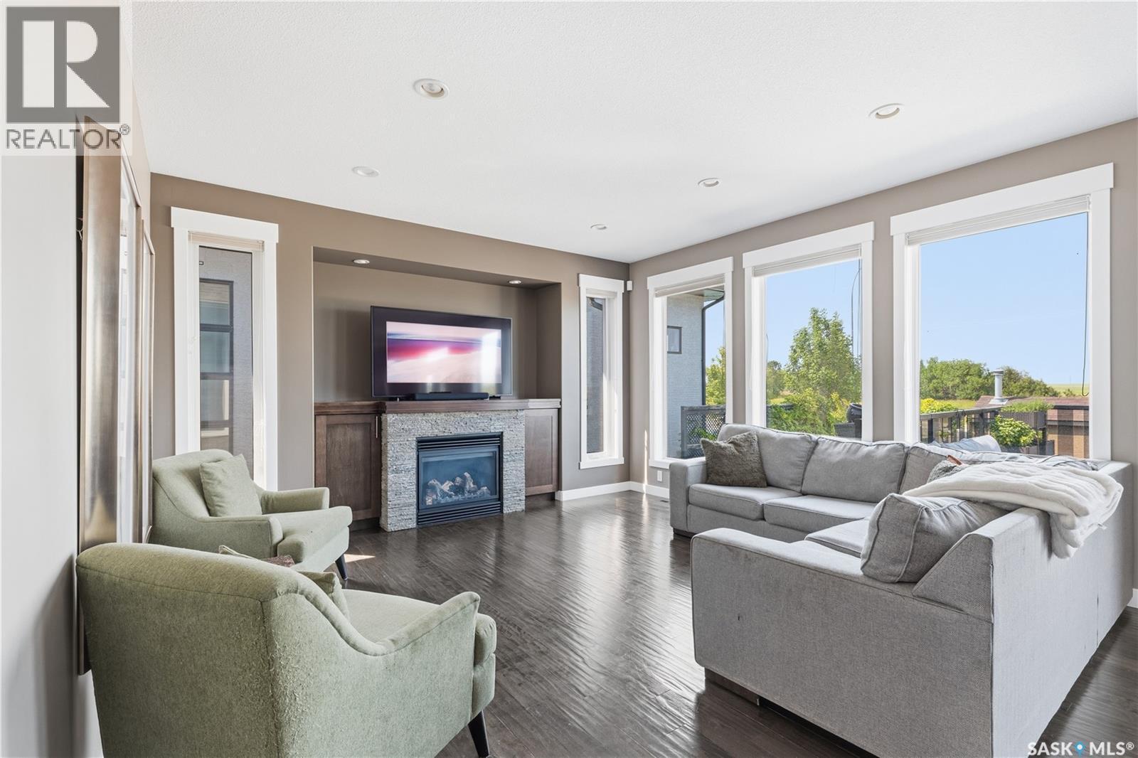 6024 Little Pine Loop, Regina, SK - Indoor Photo Showing Living Room With Fireplace