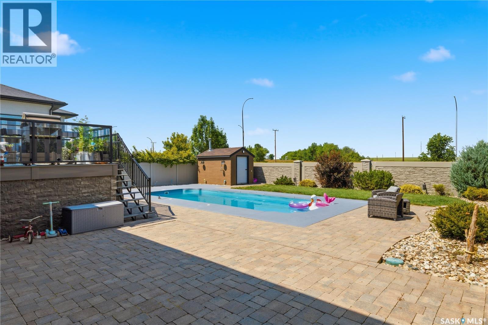 6024 Little Pine Loop, Regina, SK - Outdoor With In Ground Pool With Deck Patio Veranda