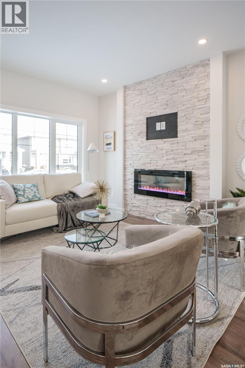 2972 Green Turtle Road, Regina, SK - Indoor Photo Showing Living Room With Fireplace