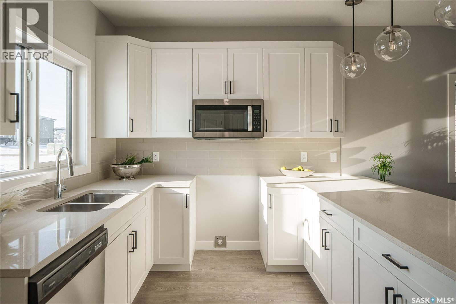 2964 Green Turtle Road, Regina, SK - Indoor Photo Showing Kitchen With Double Sink