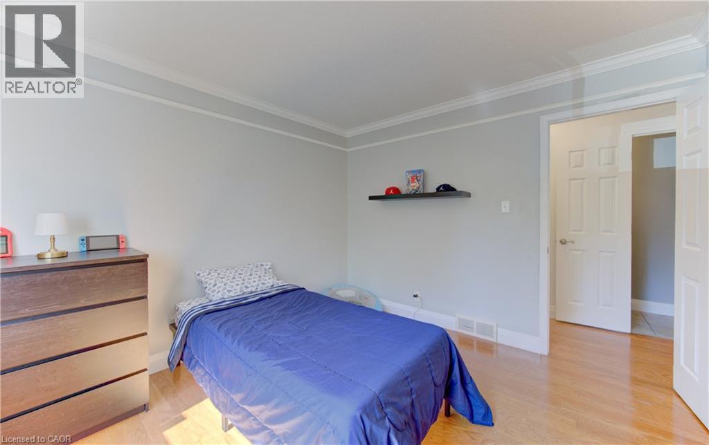 Hardwood-style flooring throughout - 106 Autumn Hill Crescent, Kitchener, ON - Indoor Photo Showing Bedroom