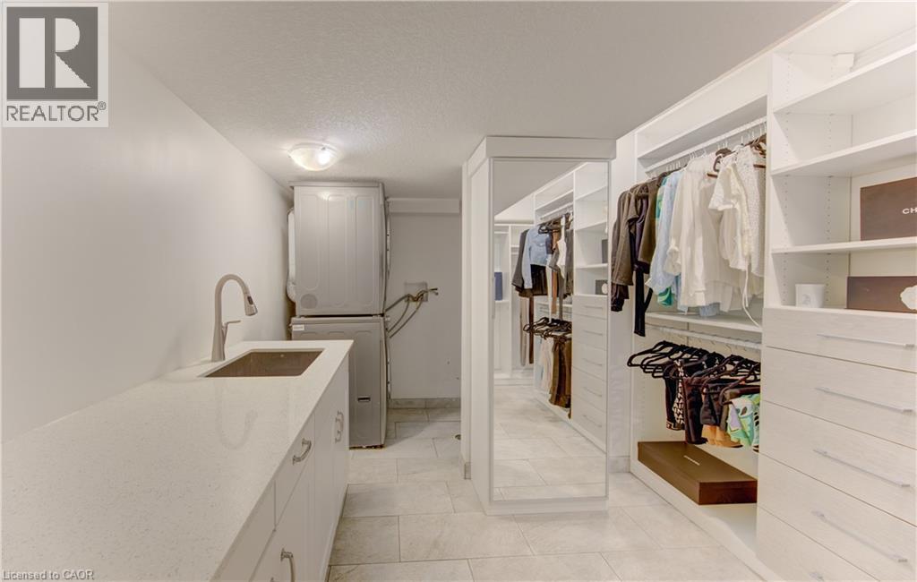 Custom closet system featuring extensive shelving and drawer storage - 106 Autumn Hill Crescent, Kitchener, ON - Indoor With Storage