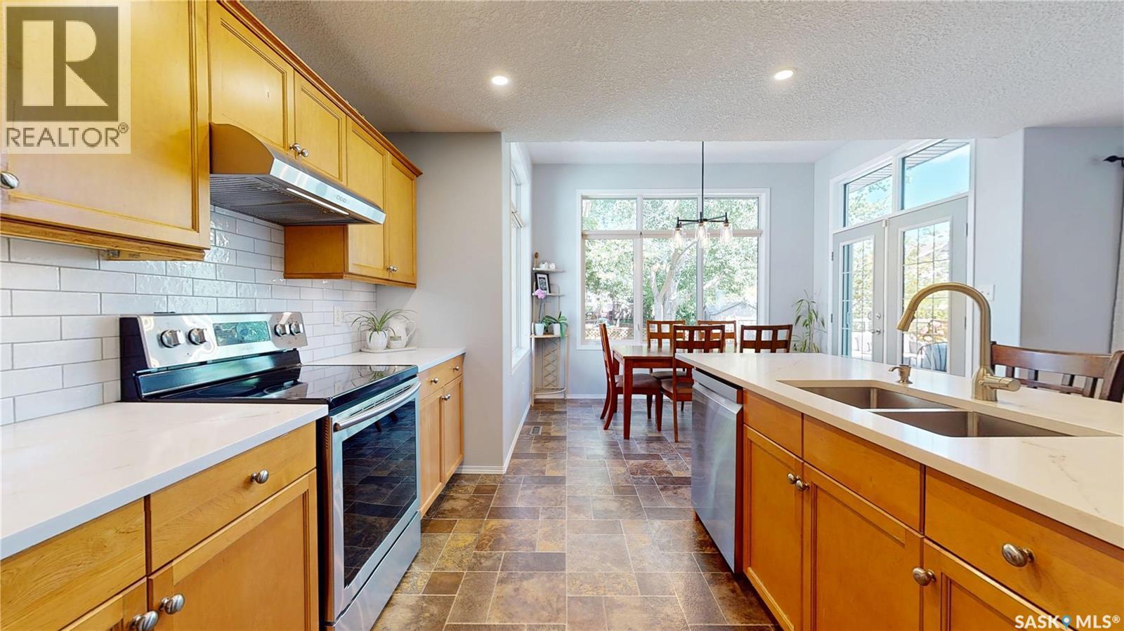 1619 Wingert Drive N, Regina, SK - Indoor Photo Showing Kitchen With Double Sink With Upgraded Kitchen