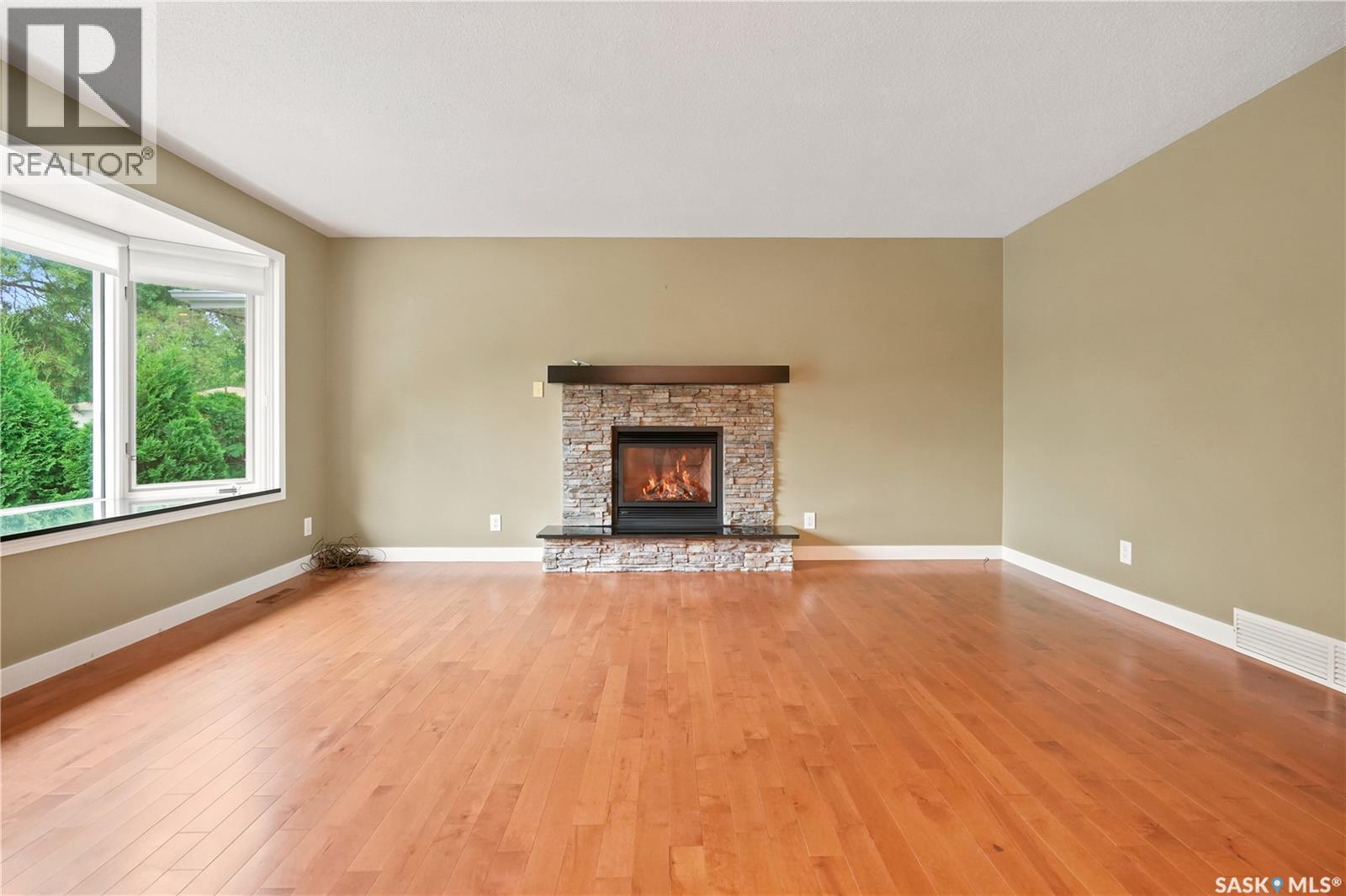 19 Thomson Avenue, Regina, SK - Indoor Photo Showing Living Room With Fireplace