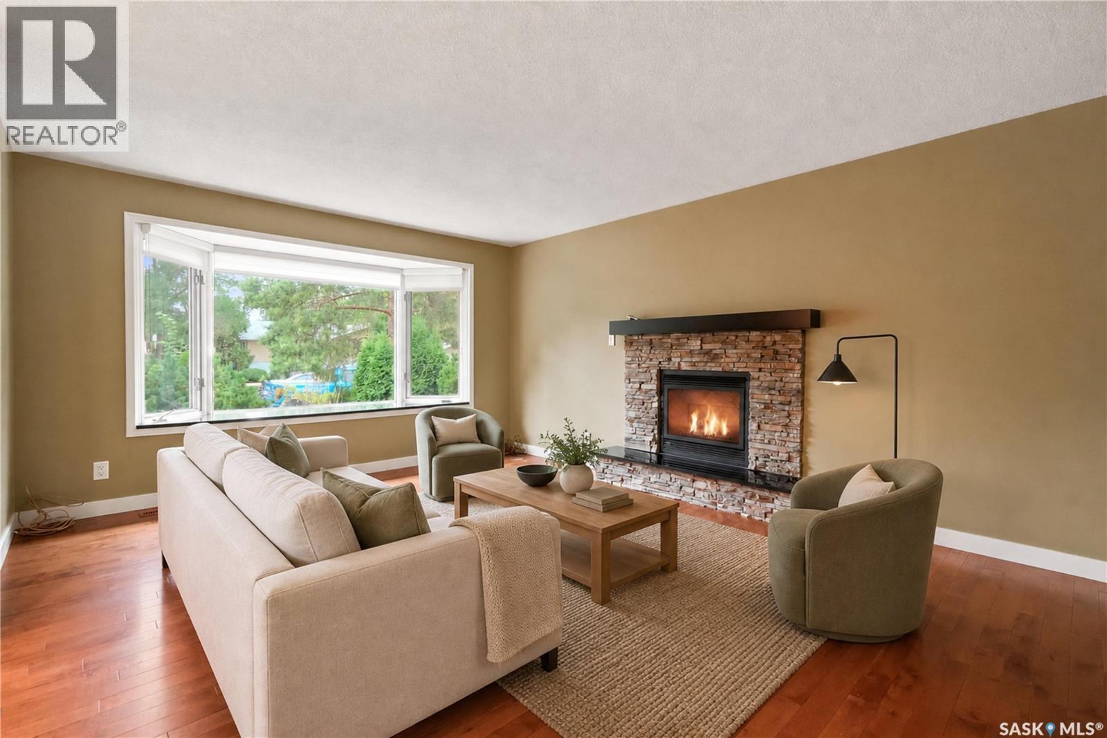 19 Thomson Avenue, Regina, SK - Indoor Photo Showing Living Room With Fireplace