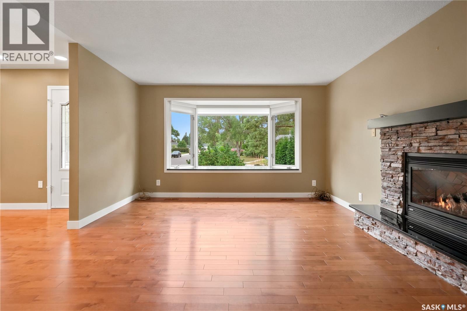 19 Thomson Avenue, Regina, SK - Indoor Photo Showing Living Room With Fireplace