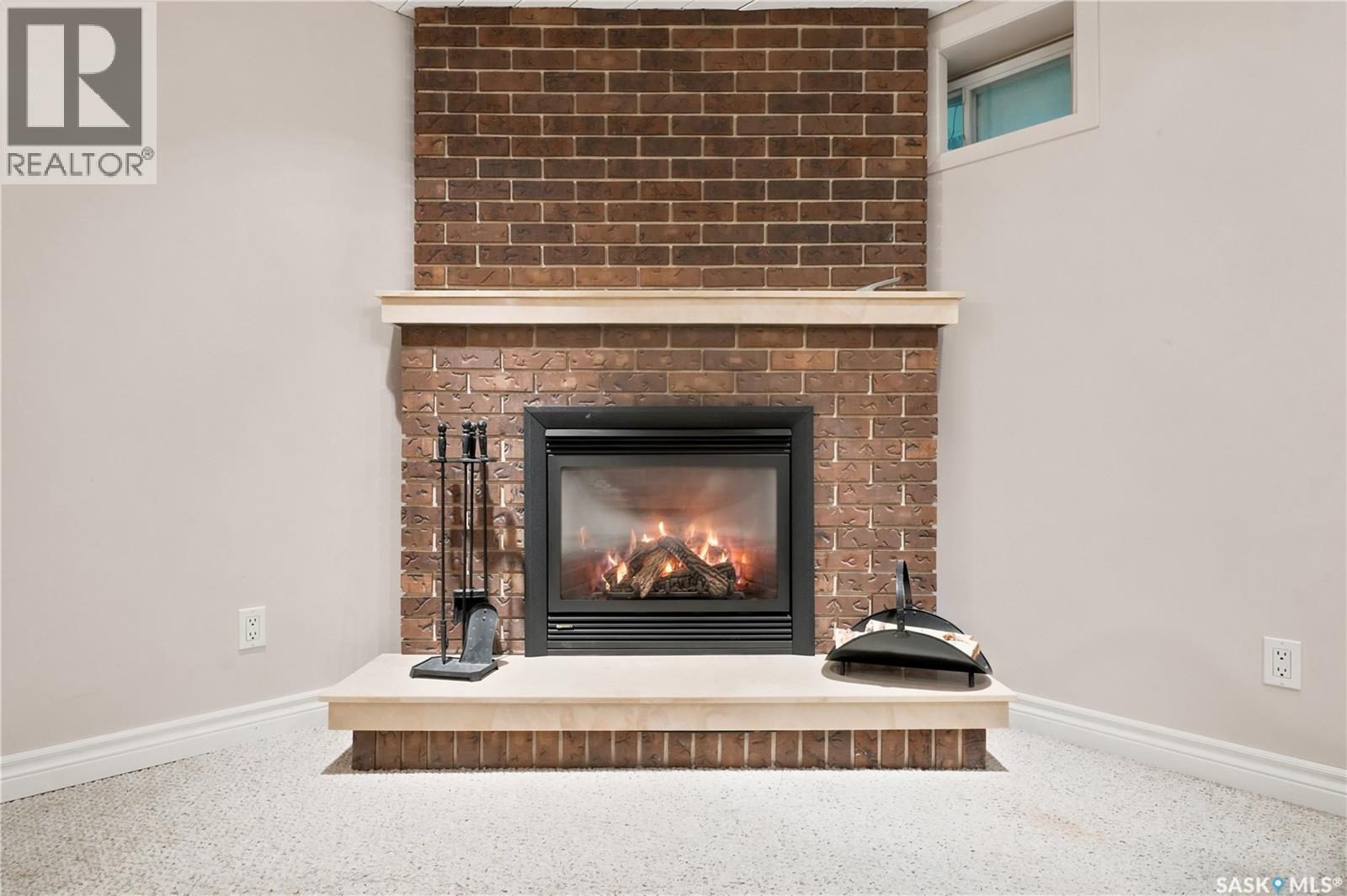 19 Thomson Avenue, Regina, SK - Indoor Photo Showing Living Room With Fireplace