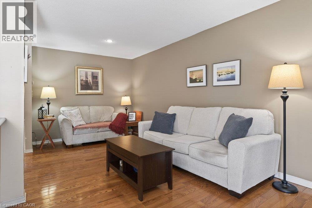 Hardwood flooring, recessed lighting, and neutral wall tones - 10 Cadham Boulevard Unit# 29, Hamilton, ON - Indoor Photo Showing Living Room
