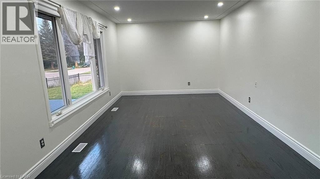 Hardwood flooring, recessed lighting, crown molding, white trim, and multiple windows - 161 Kipling Avenue, Kitchener, ON - Indoor Photo Showing Other Room
