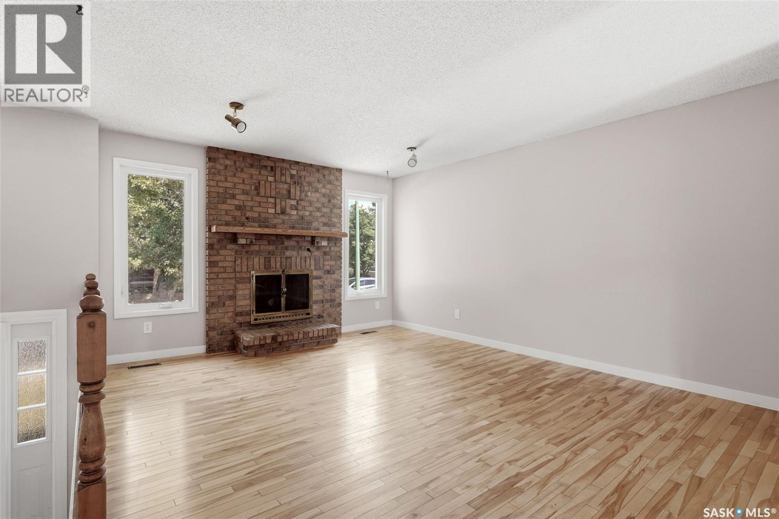 1250 Mcneill Crescent, Regina, SK - Indoor Photo Showing Living Room With Fireplace
