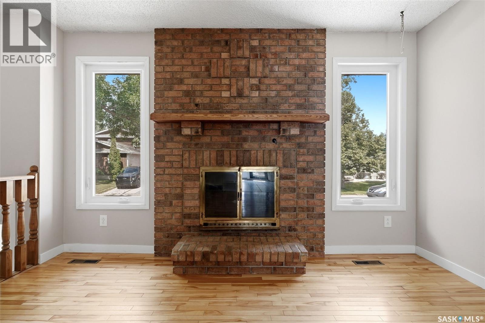 1250 Mcneill Crescent, Regina, SK - Indoor Photo Showing Other Room With Fireplace