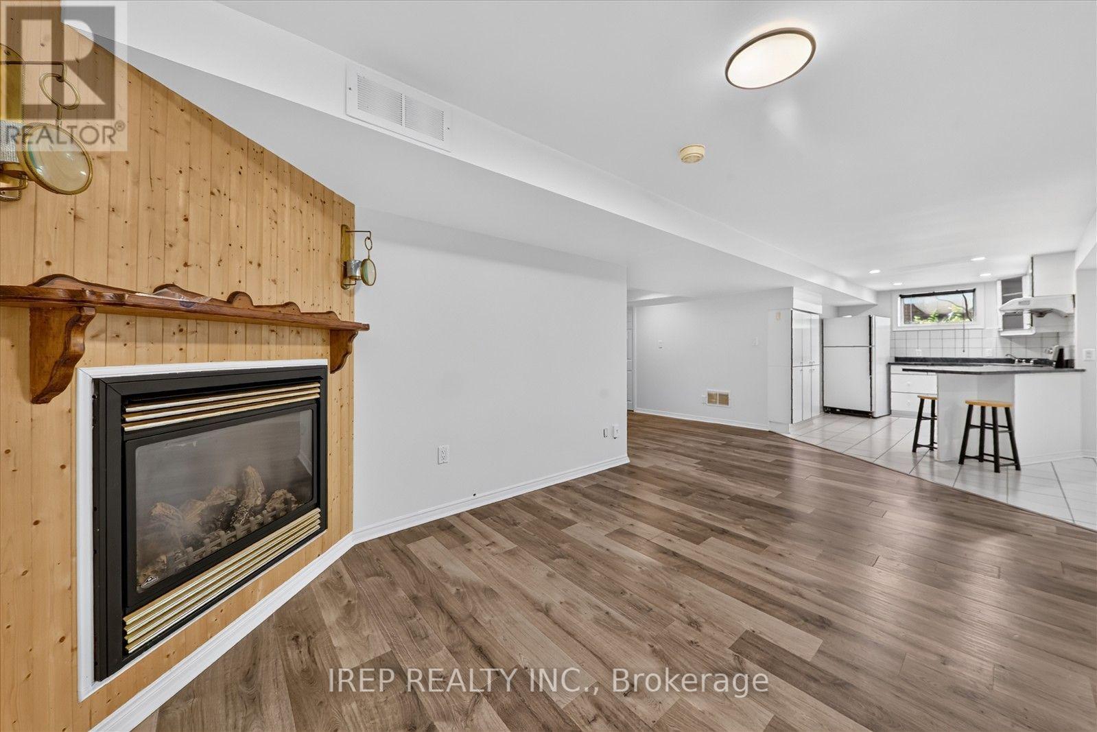 Lower - 6 Carmichael Drive, Whitby, ON - Indoor Photo Showing Living Room With Fireplace