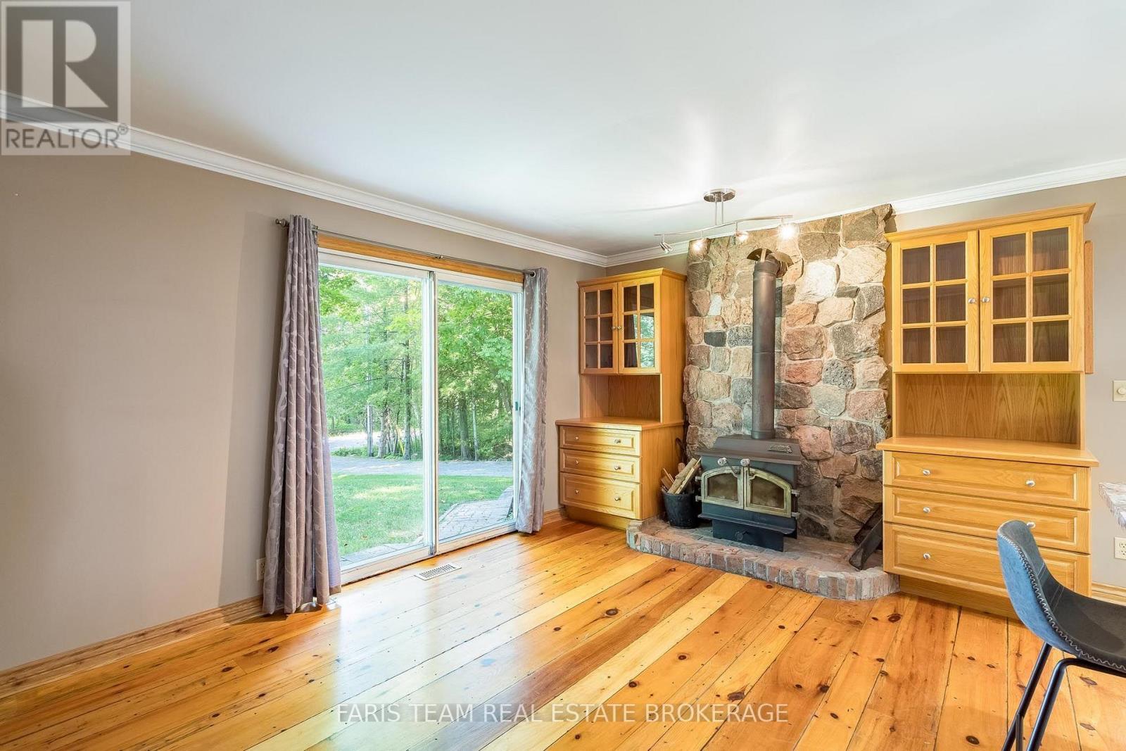 2554 Champlain Road, Tiny, ON - Indoor With Fireplace