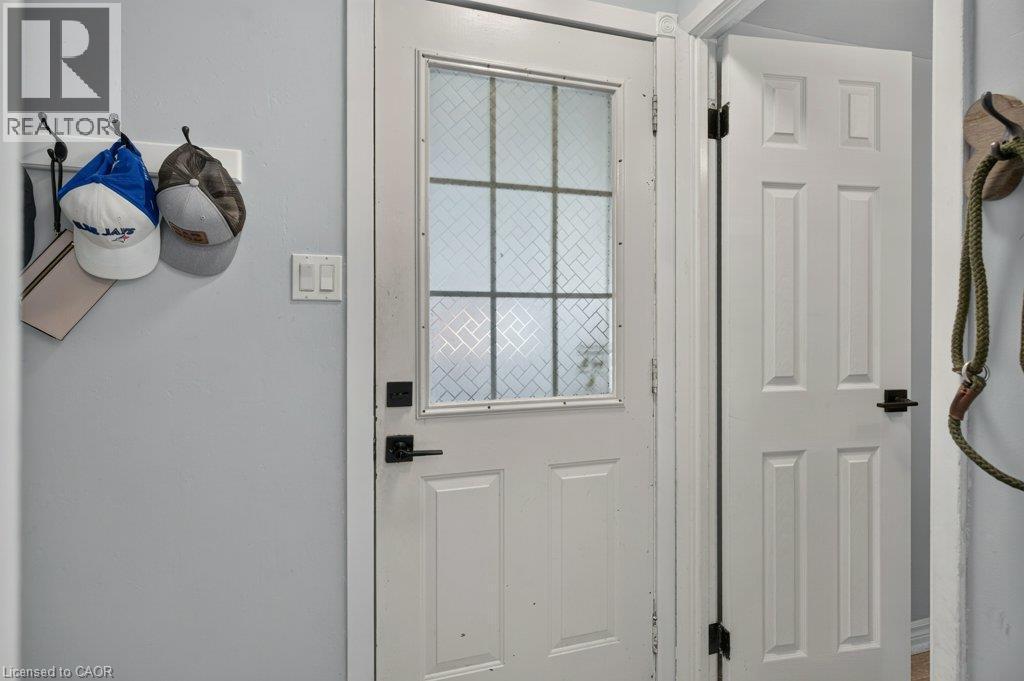 White paneled door with a decorative glass insert - 60 Elford Crescent, Hamilton, ON - Indoor Photo Showing Other Room