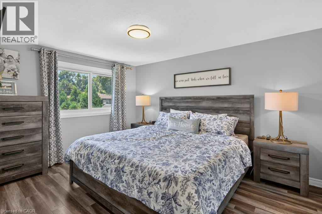 Wood-finish flooring, recessed lighting, and a window with exterior views - 60 Elford Crescent, Hamilton, ON - Indoor Photo Showing Bedroom