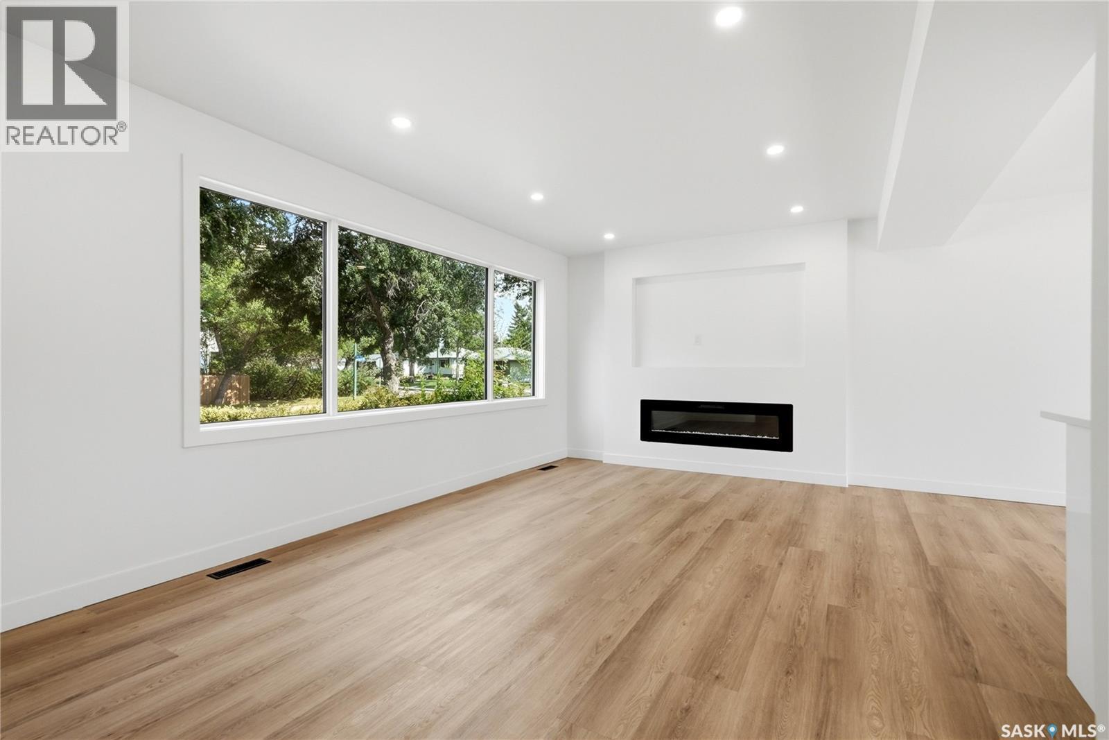 3638 Argyle Road, Regina, SK - Indoor Photo Showing Living Room With Fireplace