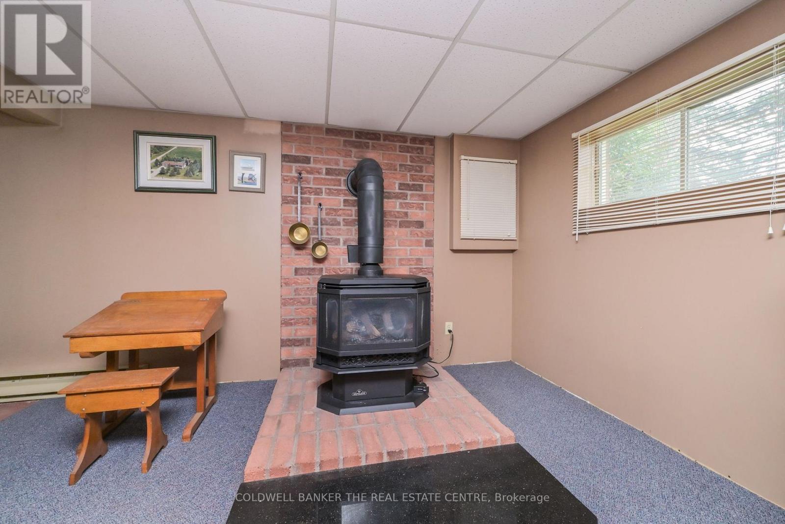 Napoleon Gas Woodstove - 5471 8Th Line, Essa, ON - Indoor With Fireplace