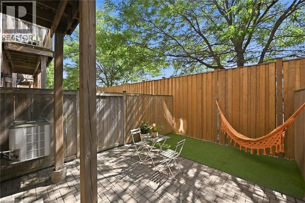 Private outdoor patio featuring paver flooring and an artificial turf area - 678 Rowley Common, Burlington, ON - Outdoor