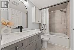 Full bath featuring vanity and shower / tub combo - 