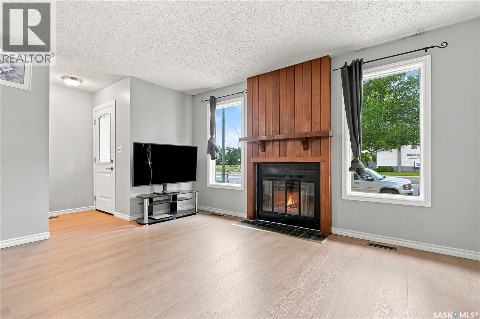 1718 Mckercher Drive, Saskatoon, SK - Indoor Photo Showing Living Room With Fireplace