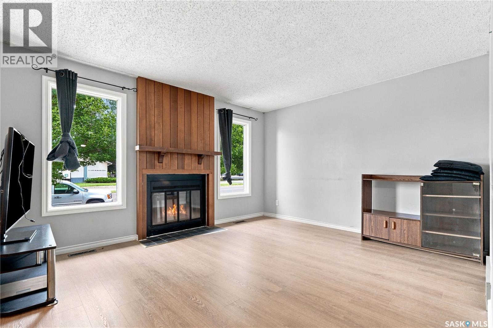 1718 Mckercher Drive, Saskatoon, SK - Indoor Photo Showing Living Room With Fireplace