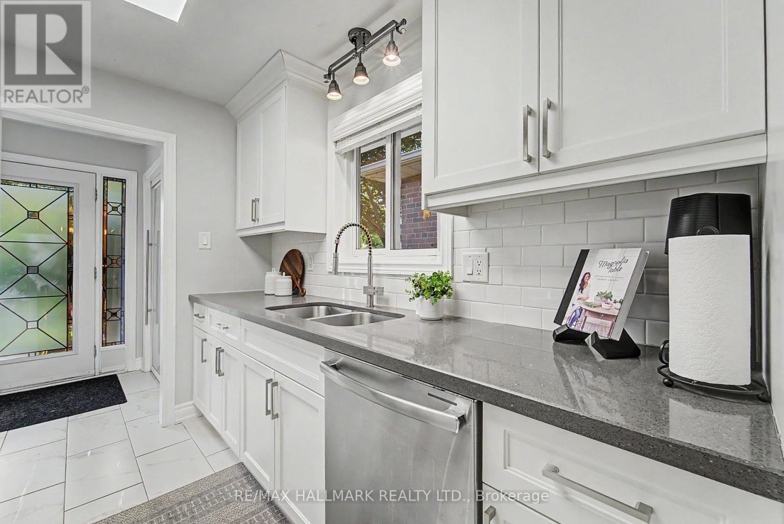 Bright updated with SS & quartz - 117 Clappison Boulevard, Toronto, ON - Indoor Photo Showing Kitchen With Double Sink