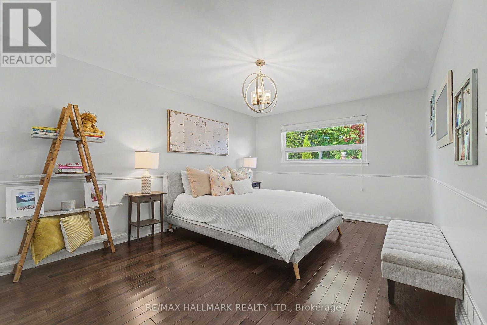 Primary bedroom hardwood overlooks pool 2 closets - 117 Clappison Boulevard, Toronto, ON - Indoor Photo Showing Bedroom