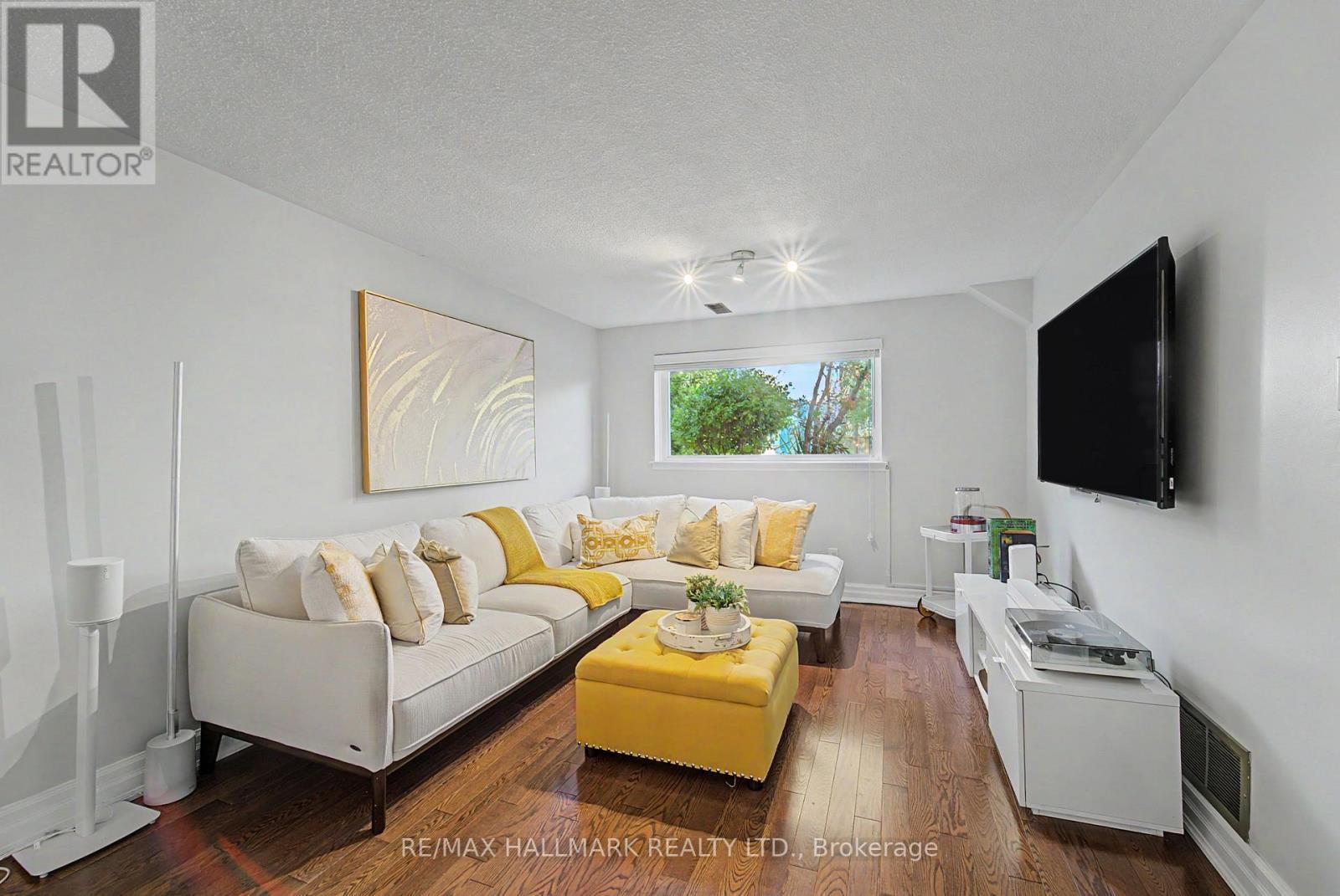 bright family room overlooking pool - 117 Clappison Boulevard, Toronto, ON - Indoor Photo Showing Living Room