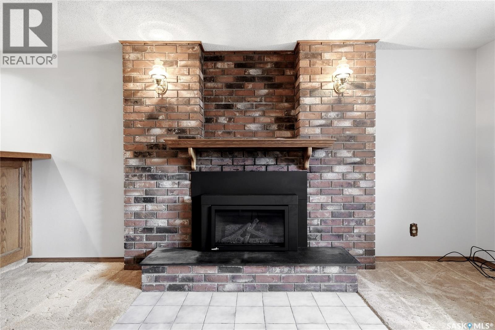 39 Hayes Crescent, Regina, SK - Indoor Photo Showing Living Room With Fireplace
