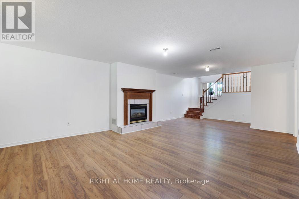Huge Family room - no carpet anywhere in the home - 53 Yoho Drive, Ottawa, ON - Indoor Photo Showing Living Room With Fireplace