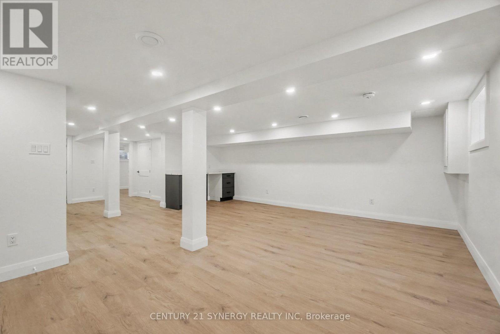 Versatile rec room w Vinyl Flooring and portlights - 2238 Utah Street, Ottawa, ON - Indoor Photo Showing Other Room